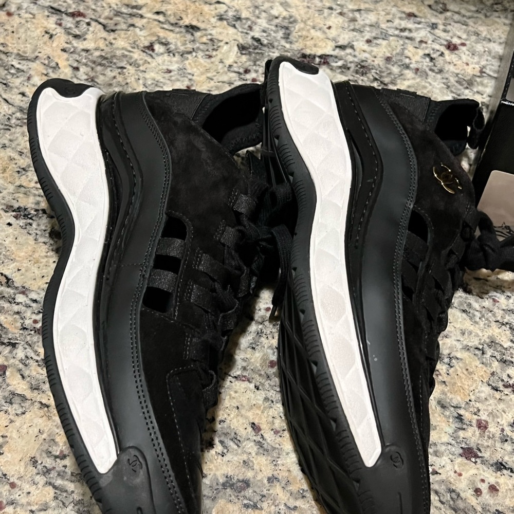 Lightly worn Chanel sneakers in black and white